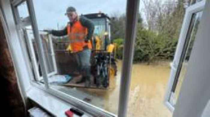 Digger driver rescues his grandparents from flood