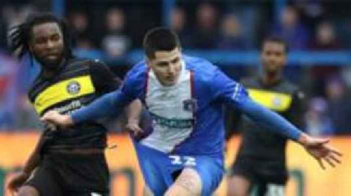 Wigan sign Carlisle defender Mellish