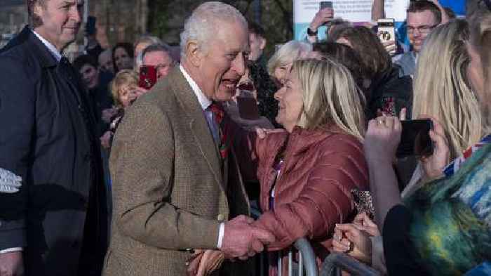 Large crowd turns out to welcome King to food bank