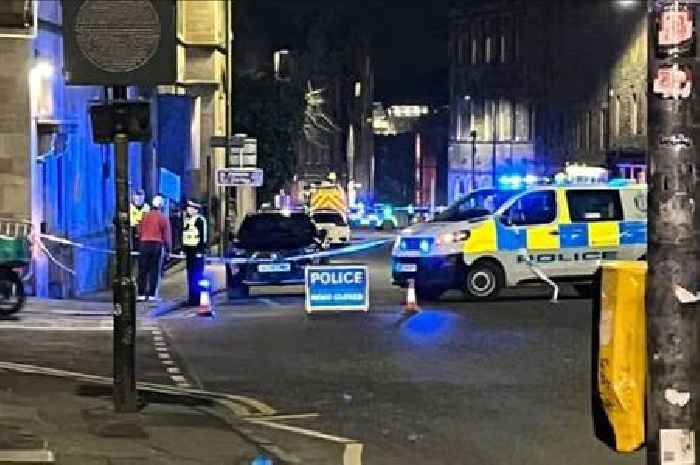 Cops lock down Edinburgh city centre street as public 'urged to avoid area'