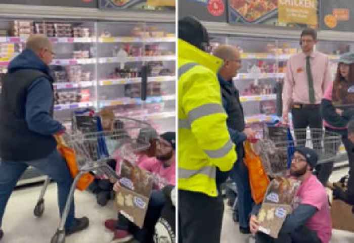 Dude Pushes Grocery Cart Through a Bunch of Protesters