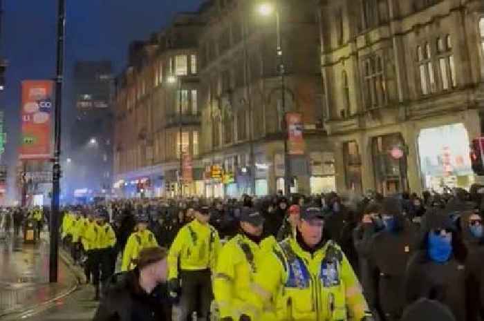 Rangers fans march through Manchester as police line streets ahead of Old Trafford clash