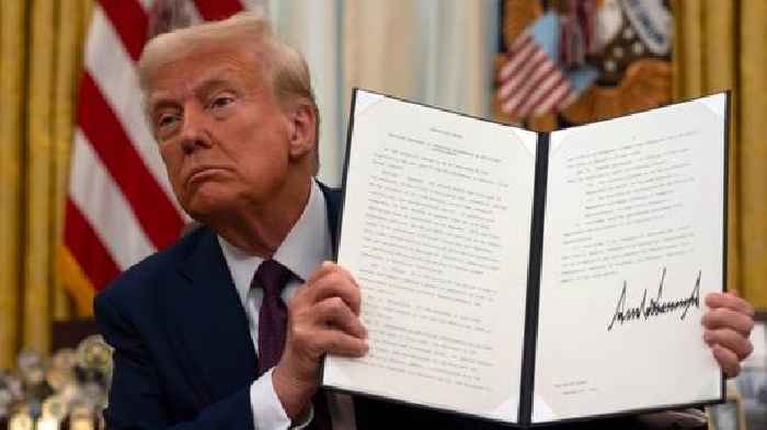 Trump signs executive orders on AI, cryptocurrency and issues more pardons