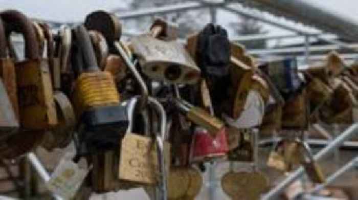 First love locks strung up at their new home