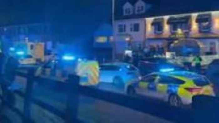 Two officers injured outside police station