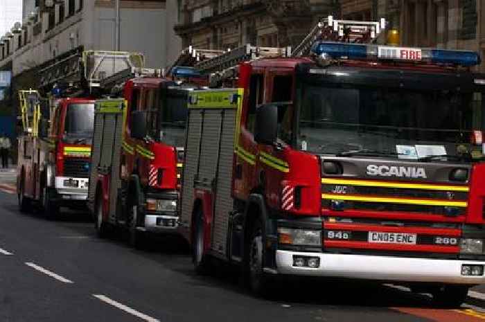 Woman trapped in car after crashing into ditch