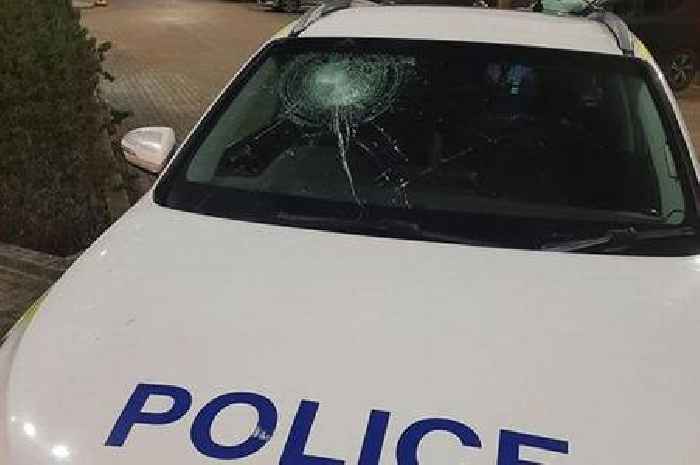 Man arrested as smashed up police cars are taken off the road