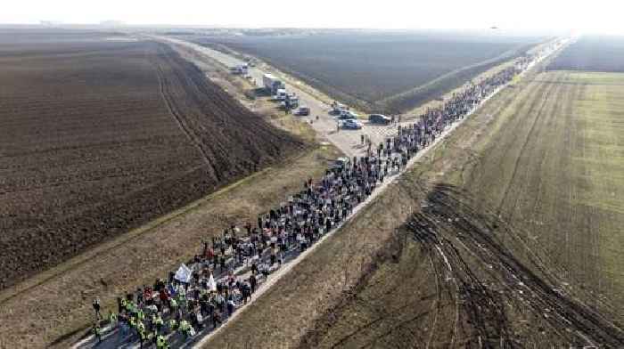 Serbian student protesters march ahead of bridge blockade as driver rams Belgrade demonstration 