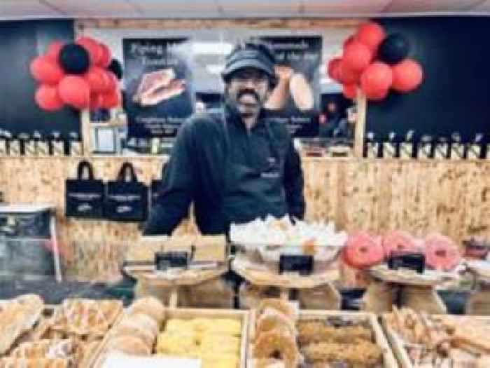 Romesh Ranganathan works behind bakery counter