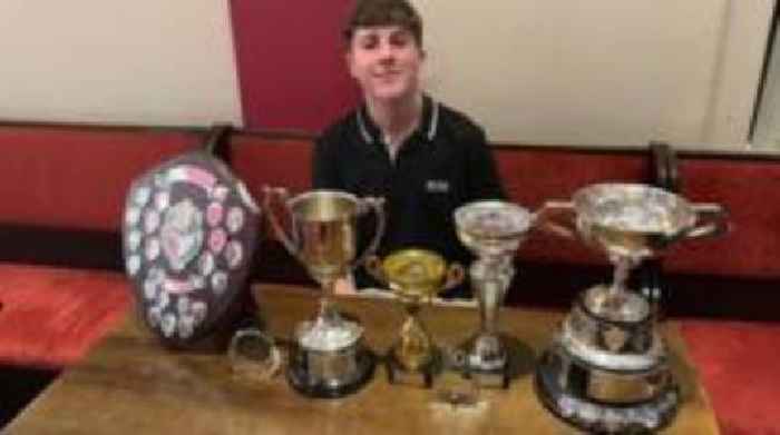 Young darts player aiming to hit career bullseye