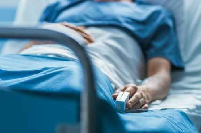NHS warns of symptoms as virus outbreak prompts hospital ward closures