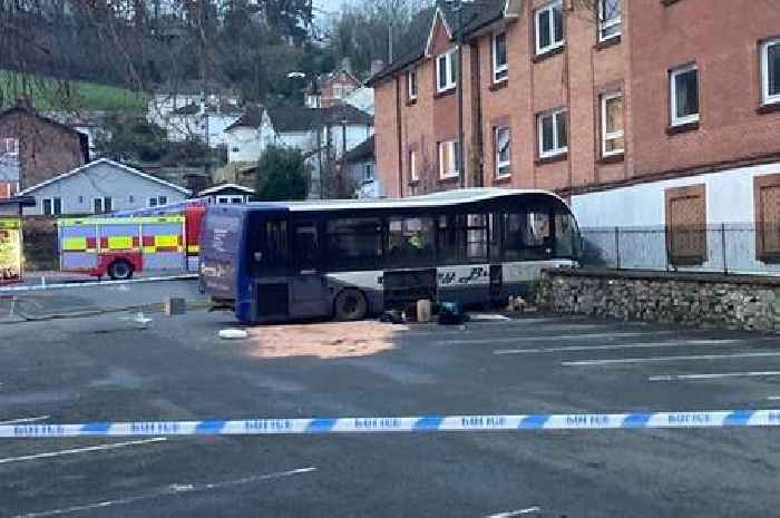 Pictures after bus careers through fence and into Newton Abbot building