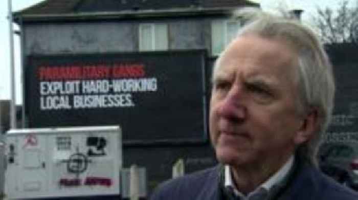 Paramilitary signs 'stigmatise' west Belfast - former Lord Mayor