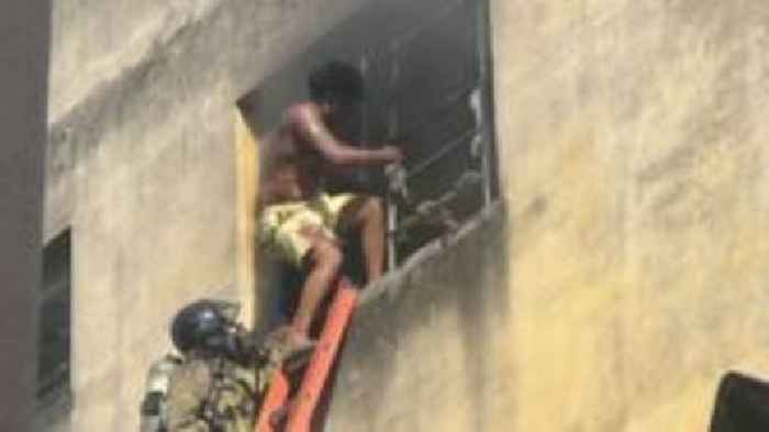 Workers rescued from window ledge as fire engulfs Rio clothing factory