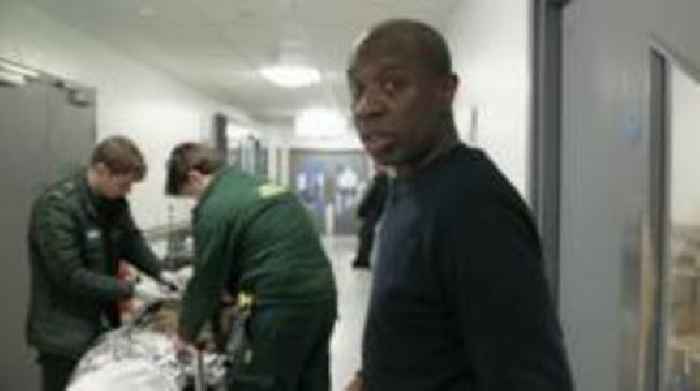 Watch: Clive Myrie finds corridors filled with patients at London hospital