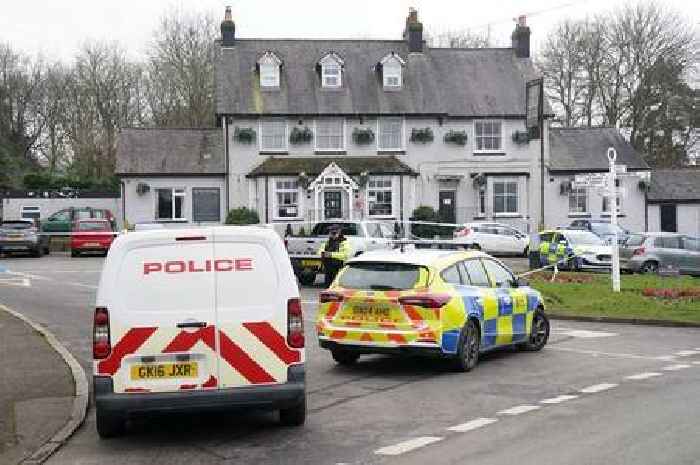 Manhunt after woman shot dead at a village pub