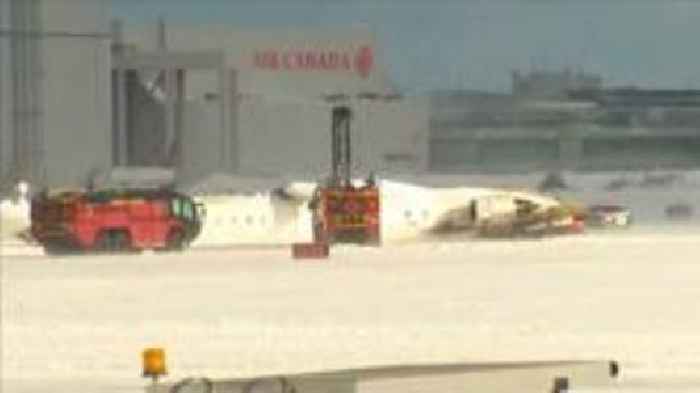 Upturned plane lies on Toronto runway after crash