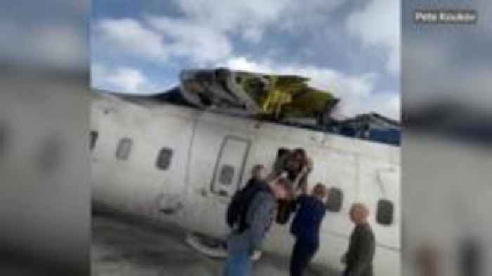 Watch: Passenger films his escape from upside down crashed plane