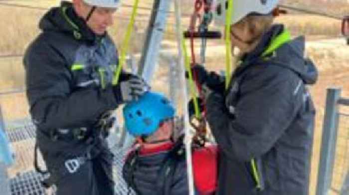 Former MP with sepsis completes zip wire challenge