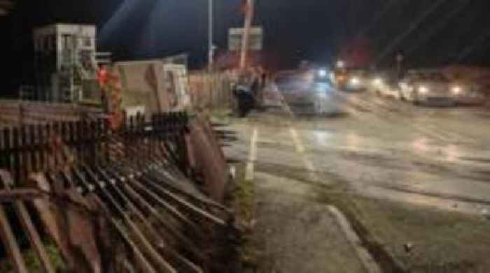 Van crashes on level crossing