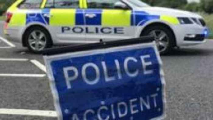 Busy road closed after car and lorry crash