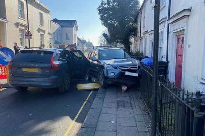 Two car crash left road in Chertsey closed for two hours