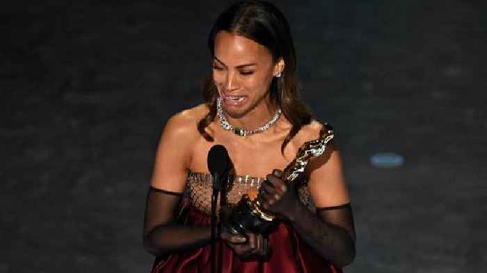 ‘Proud child of immigrant parents’: Zoe Saldana cries while accepting her Oscar