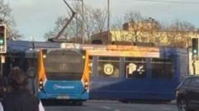 Bus and tram crash causes city rush hour delays