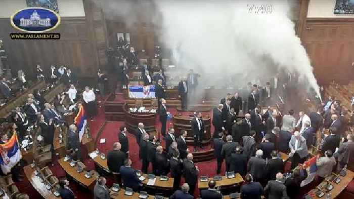 News24 | Smoke grenades tossed in Serbian Parliament, lawmaker suffers stroke