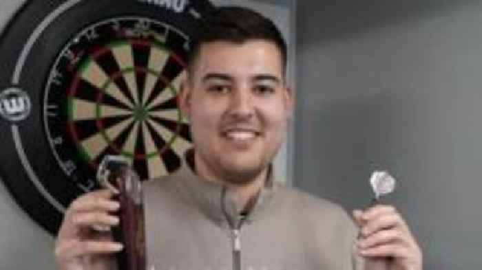 Barber proves he's a cut above as pro darts player