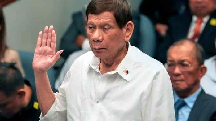 Former Philippines president flying to The Hague after 'crimes against humanity' arrest