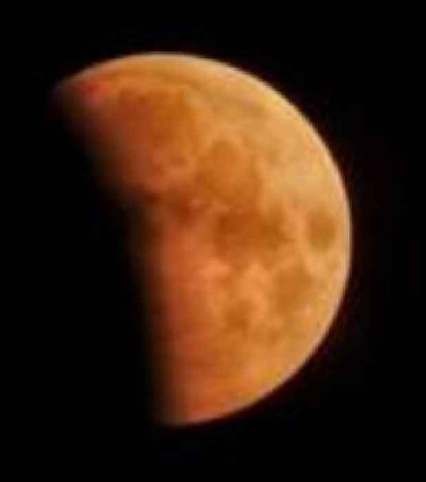 In pictures: Stargazers marvel at 'blood moon' amid lunar eclipse