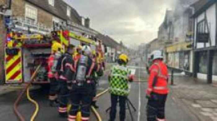 Road closed following convenience shop fire