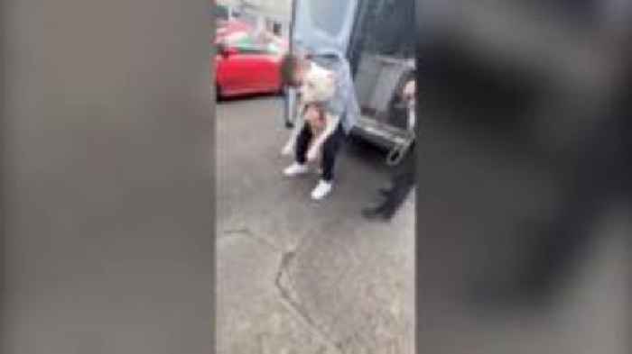 Couple reunited with 'banned' dog seized by police