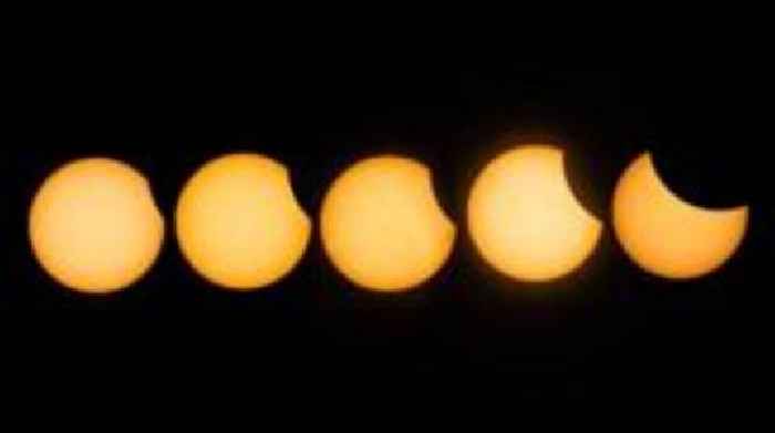 Partial solar eclipse pictured across the globe as Moon covers the Sun
