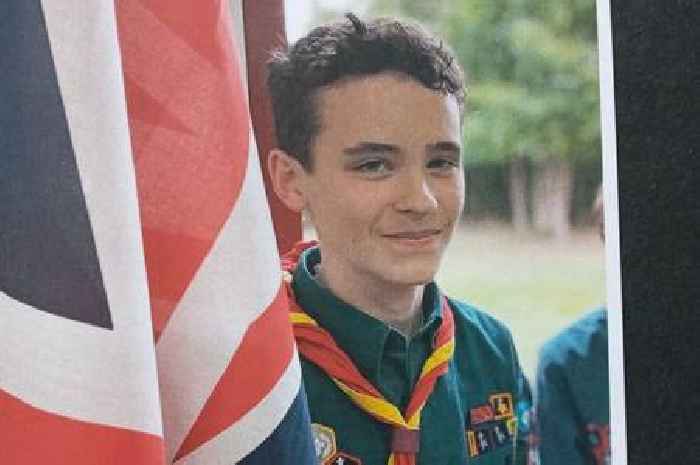 Driver using phone accelerated through red light, killing boy, 14