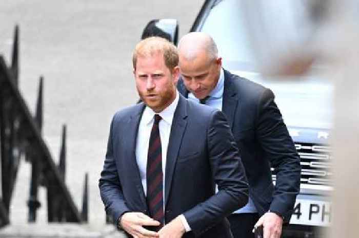 Prince Harry escorted from courtroom by bodyguards amid woman's outburst
