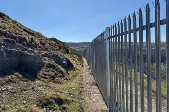 Huge row breaks out in Welsh village after 'disgusting' 2m high 'Great Wall' is built to keep people away