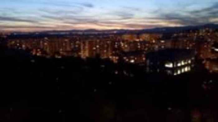 People cheer as power comes back on in Madrid