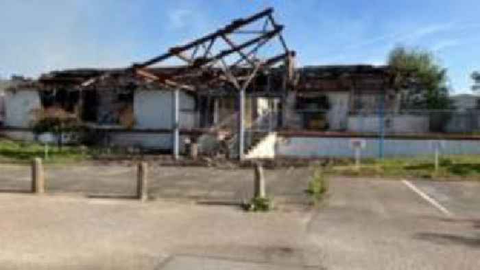 Crews remain at derelict college after blaze