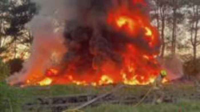 Crews remain at scene of fly-tipped tyre fire