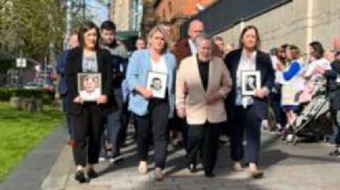 Family of murdered GAA official applauded outside court