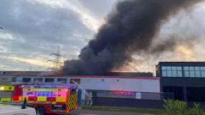 Black smoke pours from industrial unit blaze