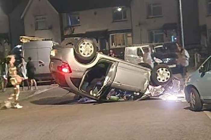 Woman taken to hospital after car flips onto its roof
