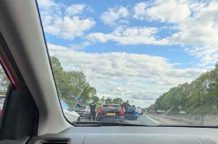 Live M6 updates as 'police stop traffic and pull two men from cars'