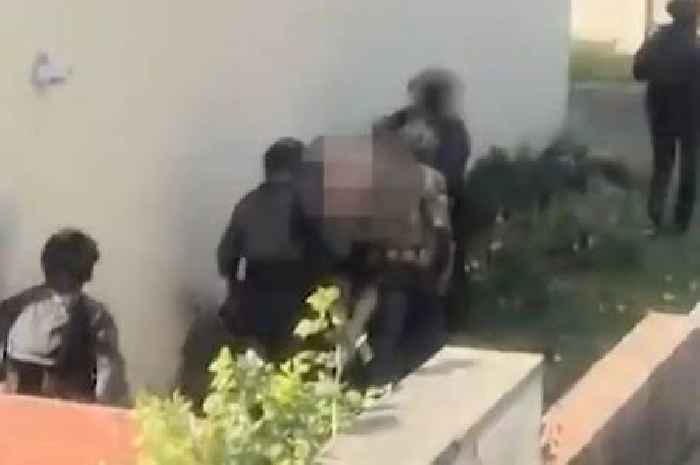 Footage shows armed cops storm house in terror sting as eight men arrested