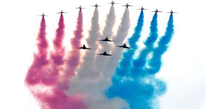 Royals watch flypast as thousands line streets for VE Day parade