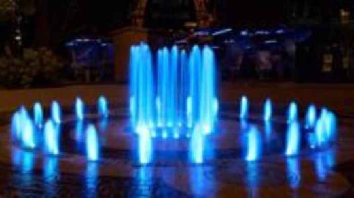 Football fans told to arrive early as city lit in blue