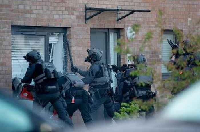 Gang war cops storm Glasgow home and seize two suspects in series of dramatic dawn raids