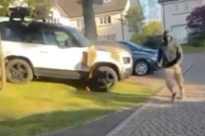 Hooded firebomb thug seen running from driveway of plush home after torching kingpin's pal's car